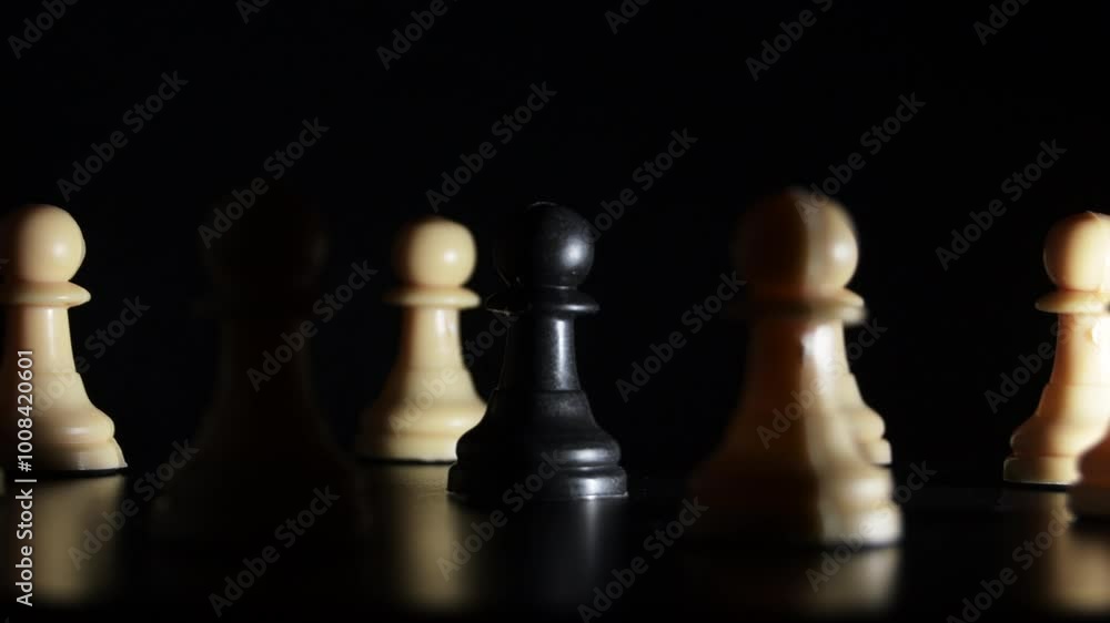 White chess pawns around a black pawn. Bullying White chess pawns around a black pawn. Bullying