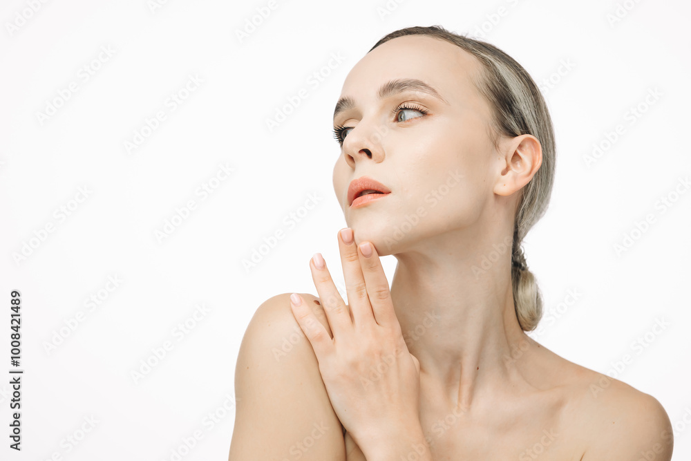 A portrait of a young, beautiful woman with perfectly smooth skin against a white background. This image embodies tenderness and sensuality, highlighting the essence of natural beauty and skincare. A portrait of a young, beautiful woman with perfectly smooth skin against a white background. This image embodies tenderness and sensuality, highlighting the essence of natural beauty and skincare.