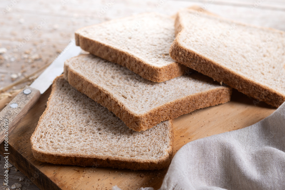 Healthy wholemeal bread slices on wooden table Healthy wholemeal bread slices on wooden table