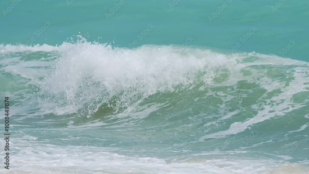 Waves gently rolling onto the sandy beach in slow motion in slow motion 300fps Waves gently rolling onto the sandy beach in slow motion in slow motion 300fps