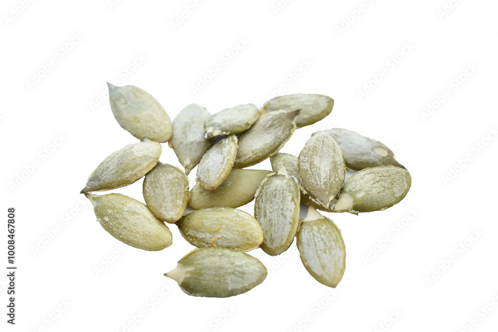 Obraz premium Peeled pumpkin seeds lie in a pile on a white background.