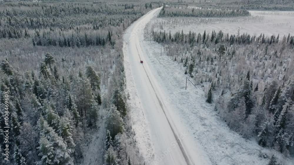 Red Car Driving on Snow Covered Road in Vast Open Arctic Winter Landscape in Northern Sweden, Travel to the Arctic Circle Red Car Driving on Snow Covered Road in Vast Open Arctic Winter Landscape in Northern Sweden, Travel to the Arctic Circle