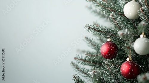 Decorated Christmas Tree in Minimalist Setting, a close-up view of a beautifully adorned tree against a clean backdrop, highlighting festive ornaments and a serene atmosphere