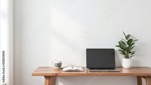 Wallpaper Mural A tidy workspace showcases a laptop on a wooden desk, accompanied by a small plant, a notebook, and a cup, creating a calm and productive atmosphere. Torontodigital.ca