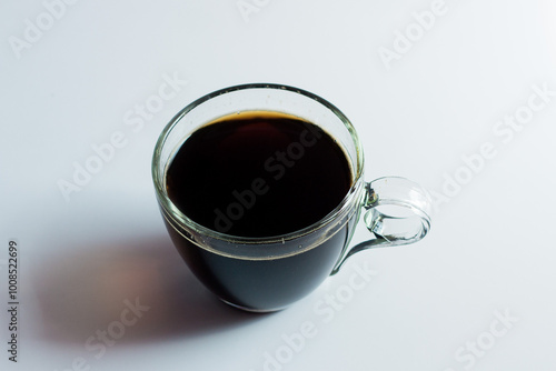 black drip coffee in glass cup  white background.