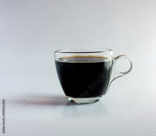 black drip coffee in glass cup  white background.