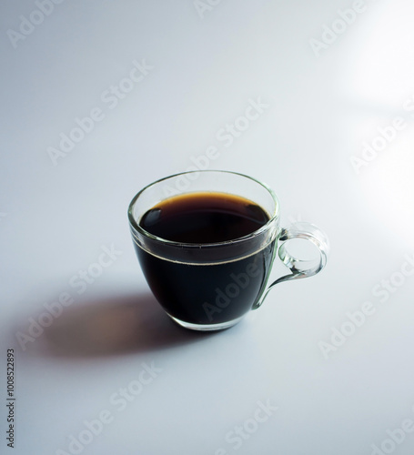 black drip coffee in glass cup  white background.