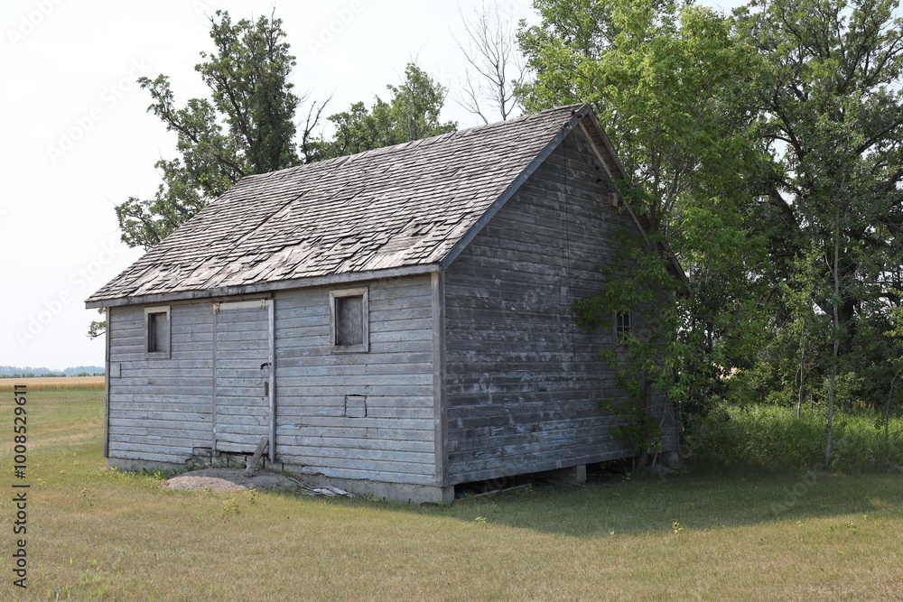 neglected rural farmhouse falling into disrepair