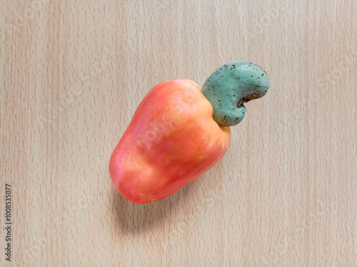 Cashew apple isolated on wooden background. Cashew apple (Anacardium occidentale). Ripe Cashew fruit.