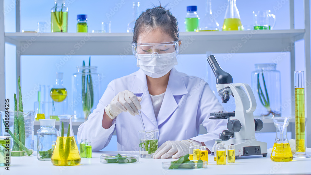 In a modern laboratory setting with tables and shelves displaying various experimental aloe vera specimens and equipment, a scientist is stirring a beaker containing a solution and aloe vera inside. In a modern laboratory setting with tables and shelves displaying various experimental aloe vera specimens and equipment, a scientist is stirring a beaker containing a solution and aloe vera inside.