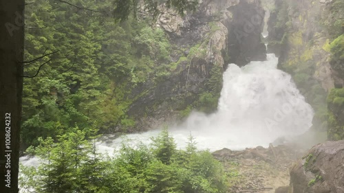 Reinbach falls or Cascate Di Riva in the Rieserferner-Ahrn Nature Park in South Tyrol Italy. The waterfall actually has three waterfalls two 50 metres (160 ft) high and one 10 metres (33 ft) high. photo