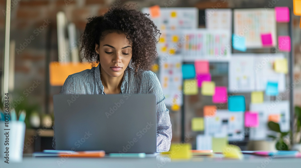 A focused project coordinator in a modern office, intently reviewing timelines on a laptop A focused project coordinator in a modern office, intently reviewing timelines on a laptop