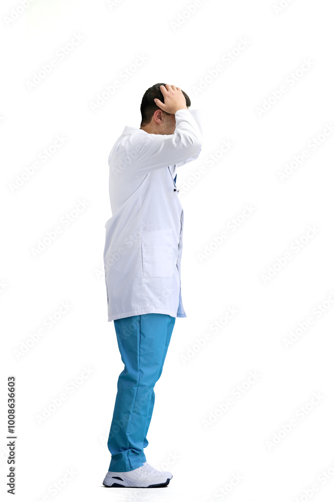 The doctor, in full height, on a white background, thinks