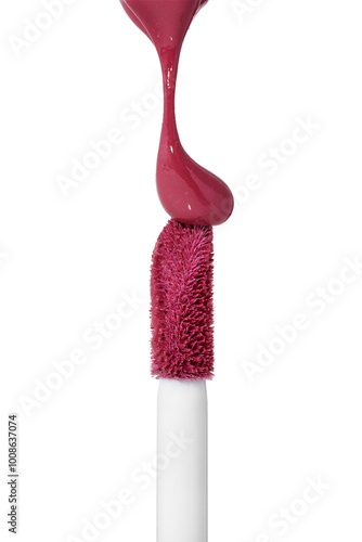 Red drop liquid lipstick falls on applicator. Closeup shot of colorful brush liquid lipstick