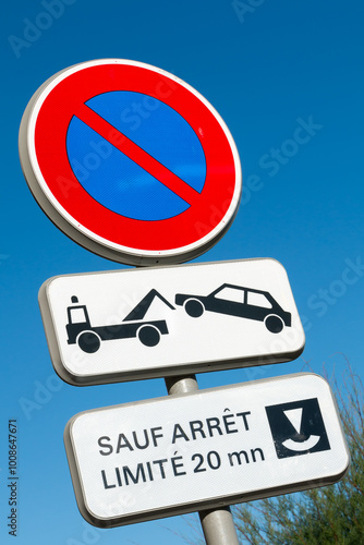 Obraz na płótnie Road sign prohibiting parking in France with sign Except Stop limited to 20 mins w salonie