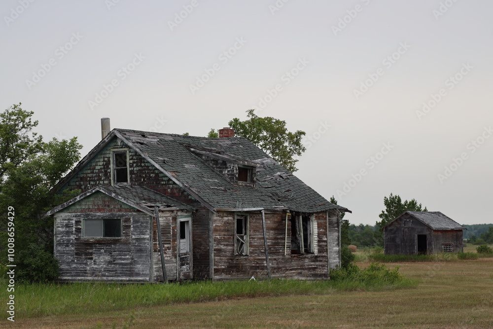 wide-angle abandoned dilapidated farm house and shed or barn wide-angle abandoned dilapidated farm house and shed or barn