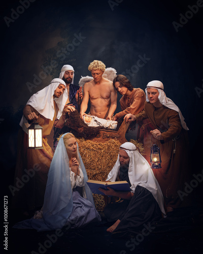 Fotografie Christmas Nativity scene with Mary, Joseph, baby Jesus, shepherds and angels praying, reading Bible