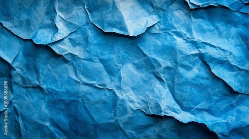 Wallpaper Mural A close-up of a crumpled blue paper, creating a textured abstract background. Torontodigital.ca