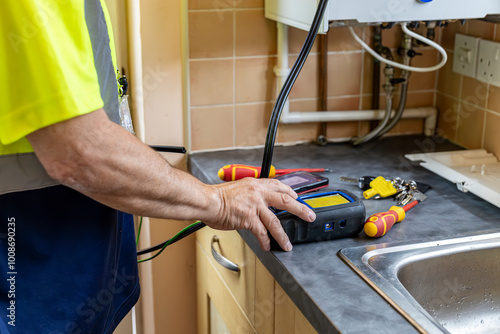 Εκτύπωση καμβά Gas service engineer operating digital flue gas analyser that is connected to do