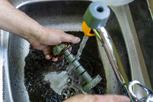 Obraz na plátně Gas service engineer technician cleaning magnetic filter for domestic central he