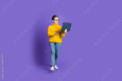 Full length photo of adorable funny woman yellow knitwear communicating modern device empty space isolated violet color background