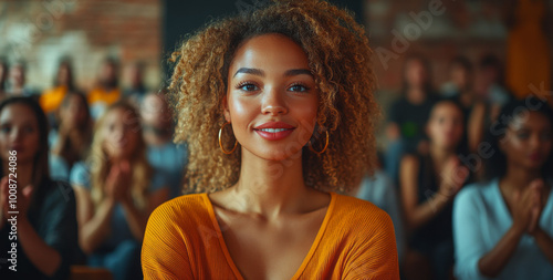 Happy, diverse business people clapping and sitting in chairs at a conference or presentation, while a female speaker is presenting her ideas to the audience during a corporate workshop event. 