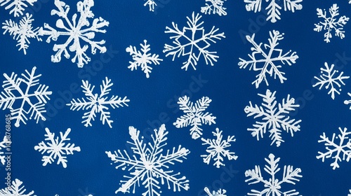 White Snowflakes on blue background seamless pattern. Christmas background