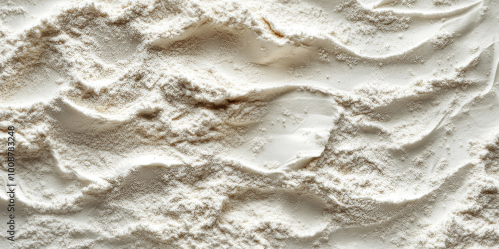 Fine powder spread across a surface creating textured patterns. Close-up view of soft white powder with intricate ridges, ideal for baking or culinary concepts. Fine powder spread across a surface creating textured patterns. Close-up view of soft white powder with intricate ridges, ideal for baking or culinary concepts.