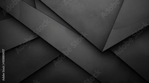 An abstract background featuring overlapping dark gray and black geometric shapes. The design showcases a modern, minimalist aesthetic with a textured surface, creating depth and visual interest.