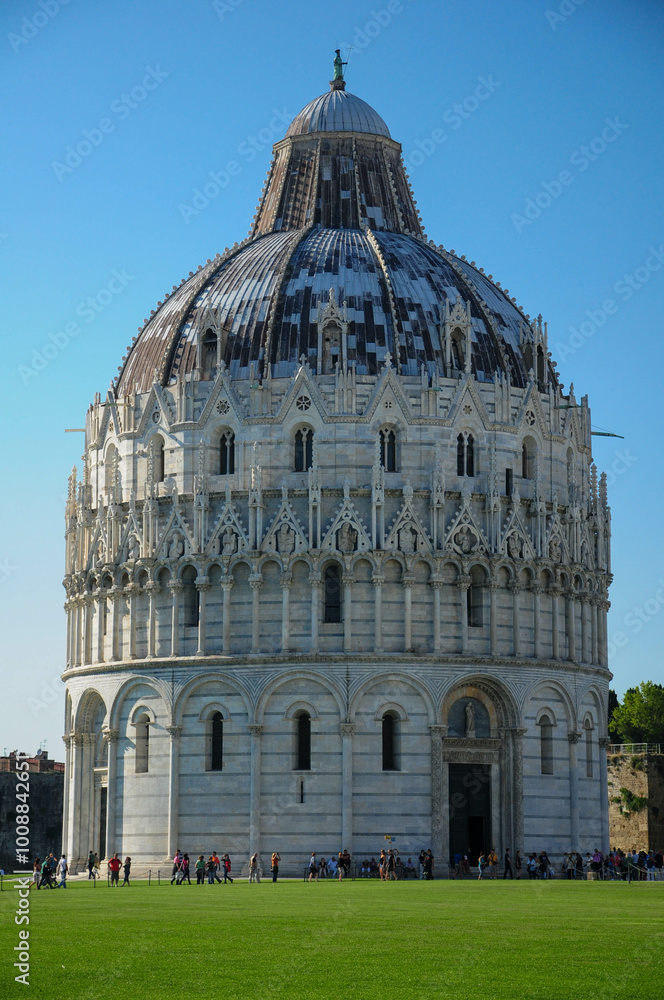 Obraz premium Pisa, Tuscany, Italy. October 22, 2010: The Pisa Baptistery of St. John in Pisa, Italy under a clear blue sky.