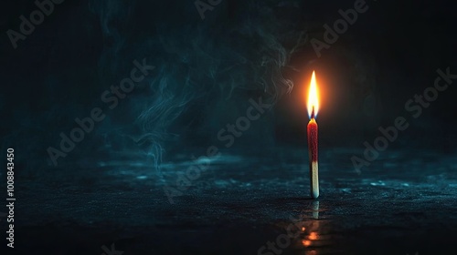 A glowing matchstick against a dark background, representing the last light in a dim room, with space for text or design.