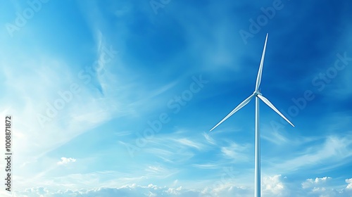 A tall wind turbine stands against a vibrant blue sky, showcasing a clean and renewable energy source. Ideal for environmental themes and technology concepts.