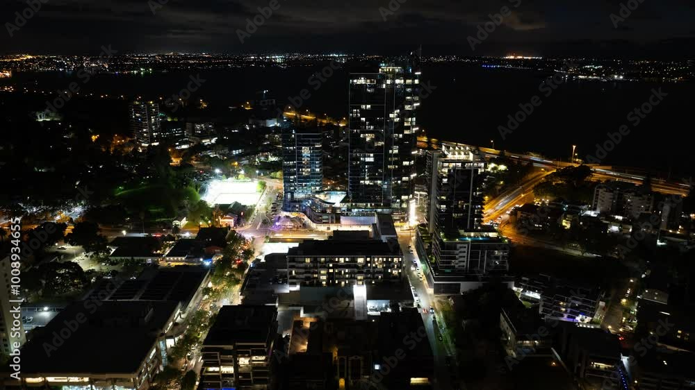 4K Aerial timelapse in motion or hyperlapse at night along the urban South Perth Civic Heart Apartments interstate with cars, traffic and high-rise buildings and houses below. 4K Aerial timelapse in motion or hyperlapse at night along the urban South Perth Civic Heart Apartments interstate with cars, traffic and high-rise buildings and houses below.
