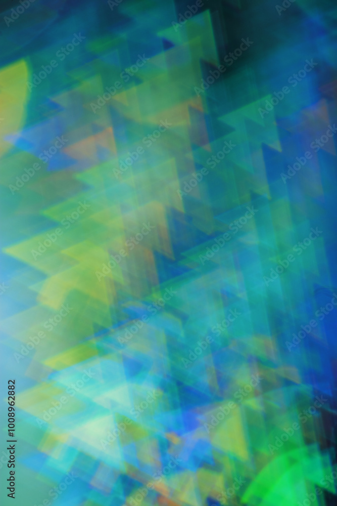 Fototapeta premium Abstract Festive Light with Christmas Tree Shapes, figured Bokeh as Soft Background, natural flare from lights, blurred texture as winter holidays backdrop, celebration idea with optical effect