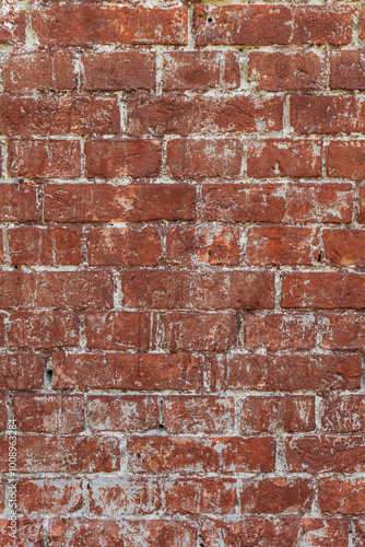 Antique brick wall background, ancient red brick masonry surface. Vintage textured background of red brick wall.