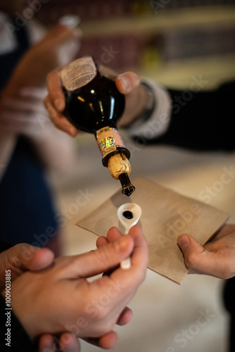 A moment of balsamic vinegar tasting in a vinegar factory