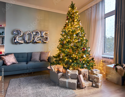 christmas living room.A tall, glittering New Year’s tree with sparkling lights and silver ornaments, with balloons shaped like 