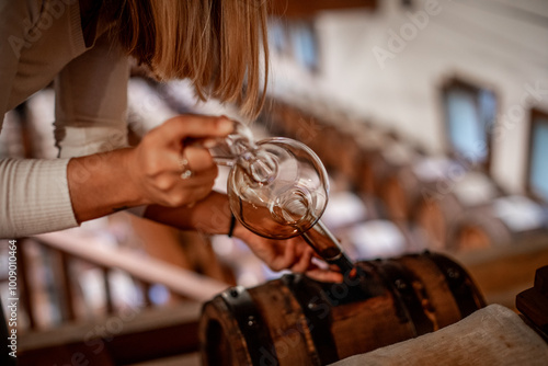 The decanting of balsamic vinegar is traditionally done with a glass instrument that in addition to decanting allows for quality control.