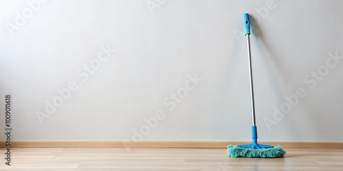 reusable microfiber mop with long handle stands upright against clean wall, showcasing its practical design for efficient cleaning. This tool is perfect for maintaining spotless floors