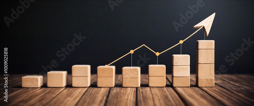Wooden blocks forming increasing graph showing business growth