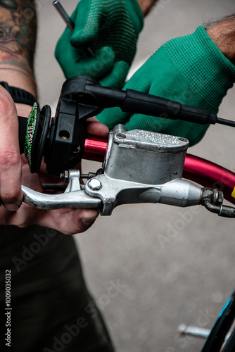 Hand holding the throttle on a motorcycle handlebar