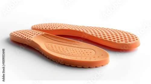 Pair of orthopedic insoles, isolated against a white backdrop, showcasing their arch support and cushioning for flat feet treatment and foot care.