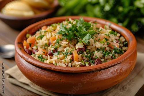 A colorful dish of baio de dois, a traditional rice and beans dish with chunks of cheese and herbs, garnished with fresh cilantro. 