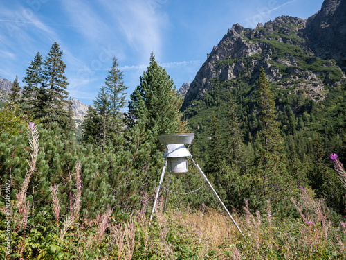 Device for measuring rainwater in front of the Popradsky Ples in the High Tatras. Meteorological station by the hiking trail. photo