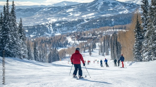 A skier making their way down a beginner slope, with ski instructors and other skiers visible in the background of the snowy resort.