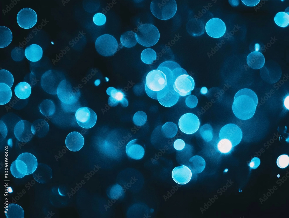 Blurred light blue circles on a dark background. Abstract bokeh lights. Blurred light blue circles on a dark background. Abstract bokeh lights.