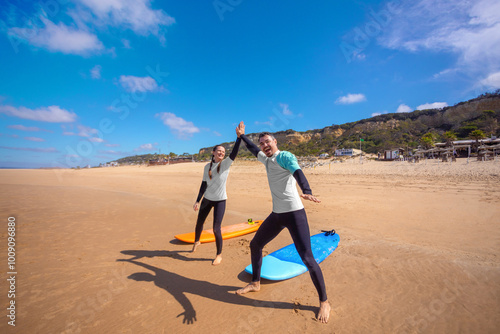 Photography Family of surfers learning to surf in the Atlantic ocean