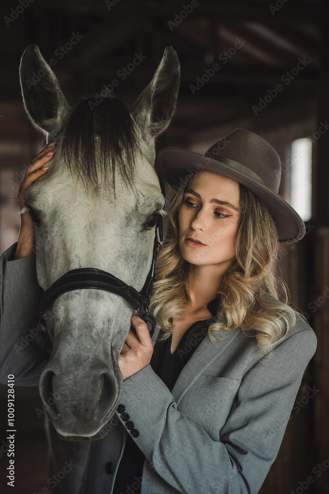 Fototapeta premium Stylish Woman and Horse in Rustic Stable