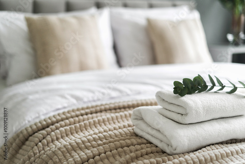 Konstfotografi White and fresh neatly folded towels on hotel bed
