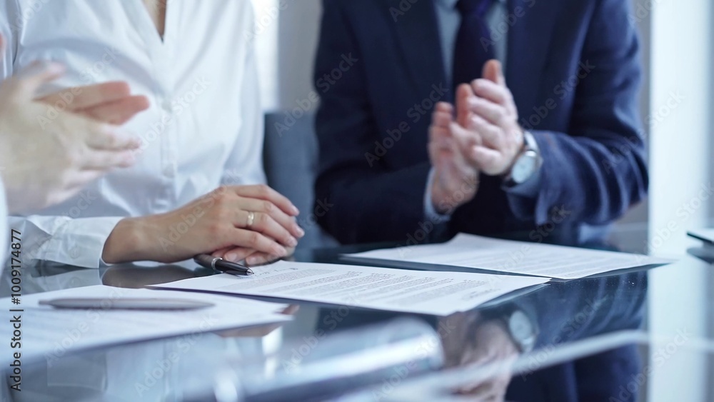 Business team wearing suits clapping hands after successful presentation. Businesspeople diverse group Business team wearing suits clapping hands after successful presentation. Businesspeople diverse group